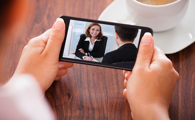 Woman Video Conferencing On Mobile Phone