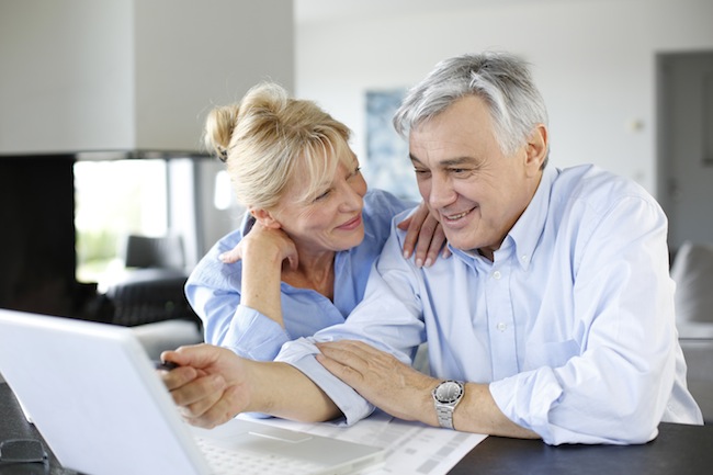 Senior couple connected with family on internet