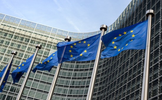 European Union flags in front of the Berlaymont building (European commission) in Brussels, Belgium.