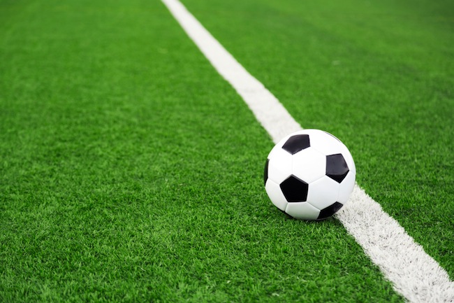 Traditional soccer ball on soccer field