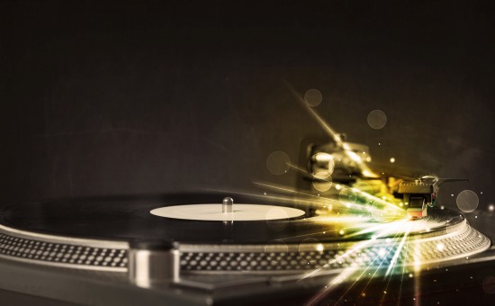 Music player playing vinyl with glow lines comming from the need